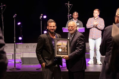 Adam Drake presented an award by President Dan Boone.