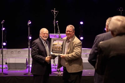 Jeff Frame presented an award by President Dan Boone.