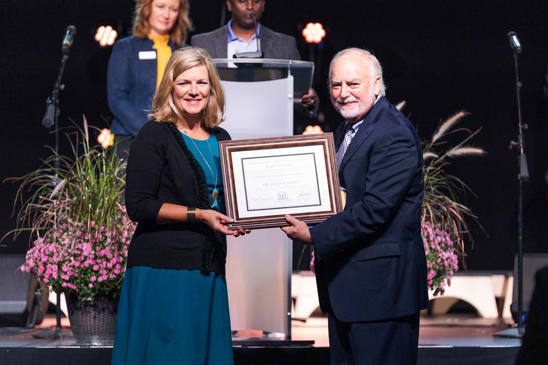 Dr. Rondy Smith is presented with an award at Trevecca.