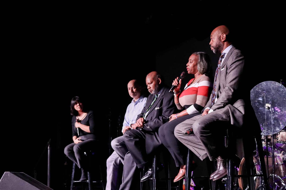 Speakers sit on a panel and discuss Dr. Martin Luther King Jr.