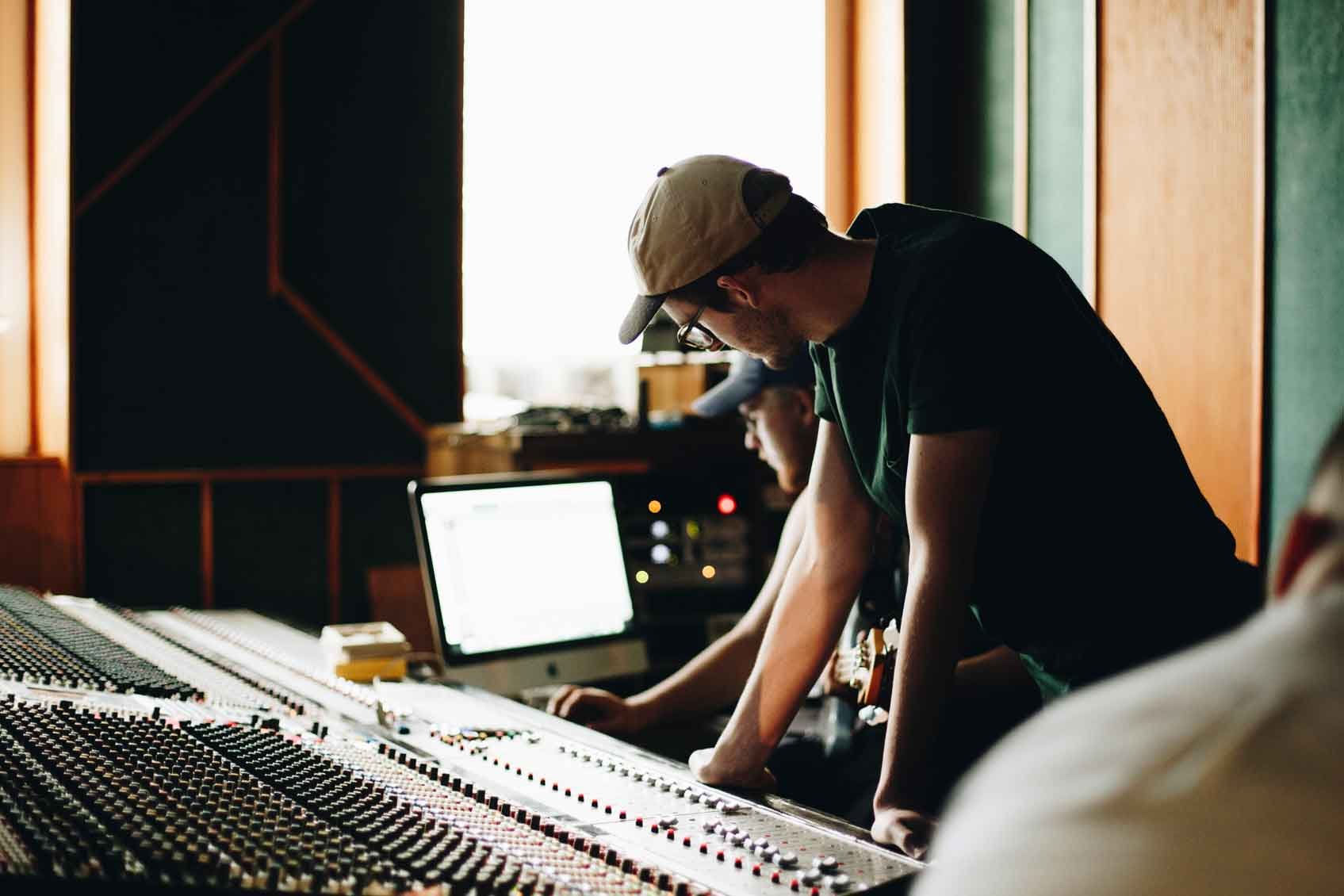 Trevecca students work on a sound board after deciding how to choose the best music business program.