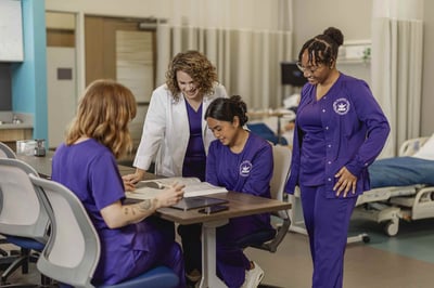 Nursing students study together.